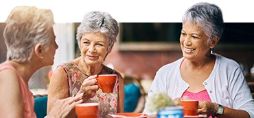 group of senior female friends enjoying a lunch date