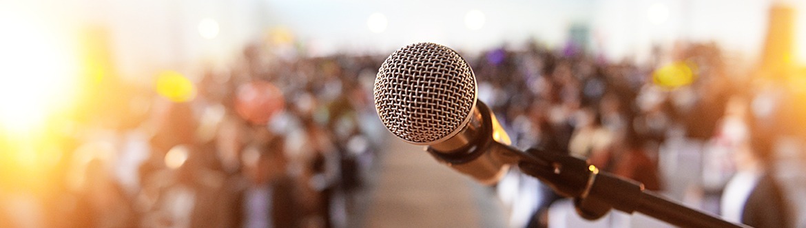 microphone in front of a blurred crowd