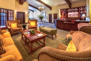 Covenant Living of Samarkand common area with couches and lounge chairs around a coffee table