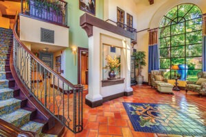 Covenant Living of Samarkand common area with staircase and lounge chairs