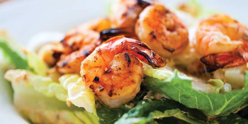 grilled shrimp over lettuce